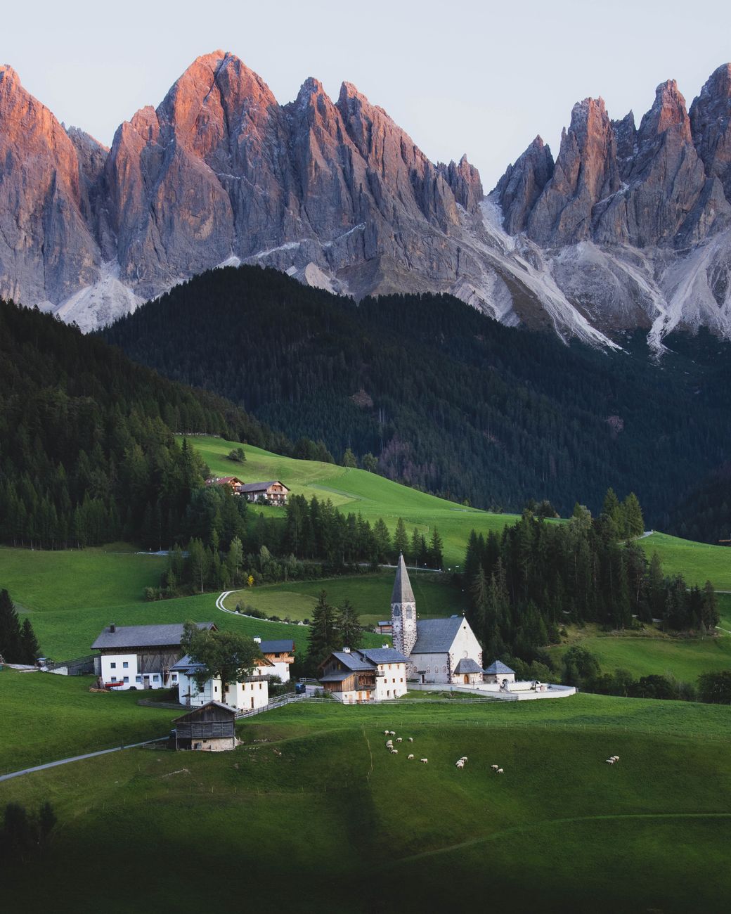 Alpine mountains of the Dolomites in misty morning light